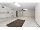 Finished basement with neutral walls and floors, drop ceiling and shelving offers versatile space for storage or recreation at 455 W Gleneagles Rd, Statesville, NC 28625