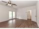 Spacious bedroom with hardwood floors, closet, a ceiling fan and natural light from the windows at 455 W Gleneagles Rd, Statesville, NC 28625