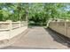 Long paved driveway leading to the home, bordered by decorative walls and lush greenery at 455 W Gleneagles Rd, Statesville, NC 28625
