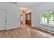 Inviting home foyer with hardwood floors, chandelier, wood front door, and window view at 455 W Gleneagles Rd, Statesville, NC 28625