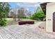 Well-maintained front yard features a patterned driveway, lush landscaping, and manicured lawn at 455 W Gleneagles Rd, Statesville, NC 28625