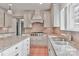 Updated kitchen featuring granite countertops, a gas range, ample cabinet space, and tiled backsplash at 455 W Gleneagles Rd, Statesville, NC 28625