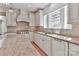 Kitchen area with tile backsplash and granite countertops and island at 455 W Gleneagles Rd, Statesville, NC 28625