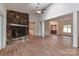 Open-concept living room boasting a stone fireplace, hardwood floors, and natural light at 455 W Gleneagles Rd, Statesville, NC 28625