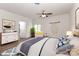 Cozy main bedroom with hardwood floors, a ceiling fan, and a bright window to outside at 455 W Gleneagles Rd, Statesville, NC 28625