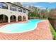 Inviting private swimming pool surrounded by a brick patio, ideal for outdoor relaxation and entertainment at 455 W Gleneagles Rd, Statesville, NC 28625