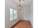 A windowed room with terracotta tiles and a pendant light at 455 W Gleneagles Rd, Statesville, NC 28625