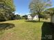 Spacious backyard featuring large trees at 4787 Rock Barn Rd, Claremont, NC 28610