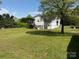 Rear view of a home with a deck and large yard at 4787 Rock Barn Rd, Claremont, NC 28610