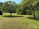 Secluded backyard with mature trees at 4787 Rock Barn Rd, Claremont, NC 28610