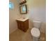 Bathroom with a vanity sink, toilet, and a framed mirror at 4787 Rock Barn Rd, Claremont, NC 28610