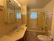 Functional bathroom with a vanity, medicine cabinet and tub-shower combination at 4787 Rock Barn Rd, Claremont, NC 28610