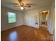 Cozy bedroom with hardwood floors and access to en suite bathroom at 4787 Rock Barn Rd, Claremont, NC 28610
