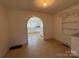 Cozy dining area featuring tile floors with an archway to the kitchen at 4787 Rock Barn Rd, Claremont, NC 28610
