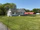 Charming cottage-style home with a well-maintained lawn and a convenient carport at 4787 Rock Barn Rd, Claremont, NC 28610