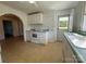 Classic kitchen featuring white appliances and view to the outdoors at 4787 Rock Barn Rd, Claremont, NC 28610