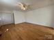 Well-lit living room with hardwood flooring and closet at 4787 Rock Barn Rd, Claremont, NC 28610