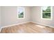 A cozy room features hardwood floors, neutral walls and trim, illuminated by natural light at 504 N Hawthorne St, Mount Holly, NC 28120
