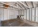 A bright, clean garage with a built-in workbench, perfect for projects and storage at 504 N Hawthorne St, Mount Holly, NC 28120
