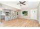 Open-concept kitchen and living area, complete with stainless appliances, quartz counters, and open floorplan at 504 N Hawthorne St, Mount Holly, NC 28120