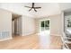 Open-concept living area, complete with hardwood floors and outdoor deck access at 504 N Hawthorne St, Mount Holly, NC 28120