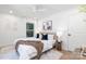 This modern bedroom features hardwood floors, neutral tones, bright natural light, and a ceiling fan at 5514 Milford Rd, Charlotte, NC 28210