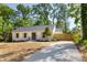 Picture of a single-story home with a well-manicured lawn and newly installed fence and driveway at 5514 Milford Rd, Charlotte, NC 28210