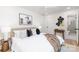 Calm main bedroom with a neutral palette, ceiling fan, en suite bath, and large windows for natural light at 5514 Milford Rd, Charlotte, NC 28210