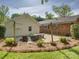 Brick patio with furniture, backyard, and an exterior view of home at 5601 Londonderry Rd, Charlotte, NC 28210