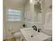 Bathroom featuring white wainscoting and a modern vanity at 5601 Londonderry Rd, Charlotte, NC 28210