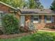 Close up of a brick home's entrance with manicured landscaping at 5601 Londonderry Rd, Charlotte, NC 28210