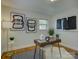 A modern home office space features hardwood floors and natural light at 5601 Londonderry Rd, Charlotte, NC 28210