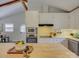 Bright kitchen featuring island, stainless steel appliances, and white cabinets at 5601 Londonderry Rd, Charlotte, NC 28210