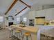 Bright kitchen featuring island, stainless steel appliances, and white cabinets at 5601 Londonderry Rd, Charlotte, NC 28210