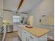 Bright kitchen featuring island, stainless steel appliances, and white cabinets at 5601 Londonderry Rd, Charlotte, NC 28210