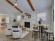 Bright living room featuring fireplace, wood beams, and white walls at 5601 Londonderry Rd, Charlotte, NC 28210