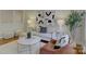 Bright living room with stylish decor, hardwood floors, and lots of natural light at 5601 Londonderry Rd, Charlotte, NC 28210