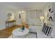 A stylish living room with hardwood floors, modern decor, and lots of natural light at 5601 Londonderry Rd, Charlotte, NC 28210