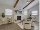 Bright living room featuring vaulted ceilings, fireplace, and lots of natural light at 5601 Londonderry Rd, Charlotte, NC 28210