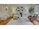 Inviting living room featuring stylish furniture, hardwood floors, and lots of natural light at 5601 Londonderry Rd, Charlotte, NC 28210