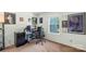 Bedroom with a gaming setup, posters, and a bright window at 6053 Treetop Ct, Charlotte, NC 28212