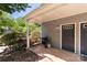Covered front porch with a grill, propane tank, house number, and storm door at 6053 Treetop Ct, Charlotte, NC 28212
