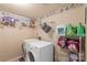 Laundry room with storage shelves and side-by-side washer and dryer at 6053 Treetop Ct, Charlotte, NC 28212