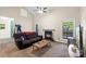 Comfortable living room with vaulted ceiling, fireplace, and a view of the outdoors at 6053 Treetop Ct, Charlotte, NC 28212