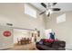 Spacious open-concept living and dining area with vaulted ceilings and ceiling fan at 6053 Treetop Ct, Charlotte, NC 28212