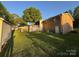 Spacious backyard featuring a shed, deck, and well-maintained lawn at 609 E Maine Ave, Bessemer City, NC 28016
