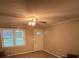 Cozy living room with carpet, ceiling fan and view of front yard at 609 E Maine Ave, Bessemer City, NC 28016