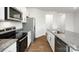 Granite counters and stainless appliances highlight this kitchen at 6157 Helens Rest Ln, Lincolnton, NC 28092