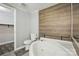 This is the bathroom which features wood paneling on the wall and a relaxing jacuzzi tub and toilet at 621 Harper Davis Rd, Lake Wylie, SC 29710