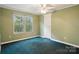 A bright bedroom features a window view and a ceiling fan with overhead lighting at 621 Harper Davis Rd, Lake Wylie, SC 29710
